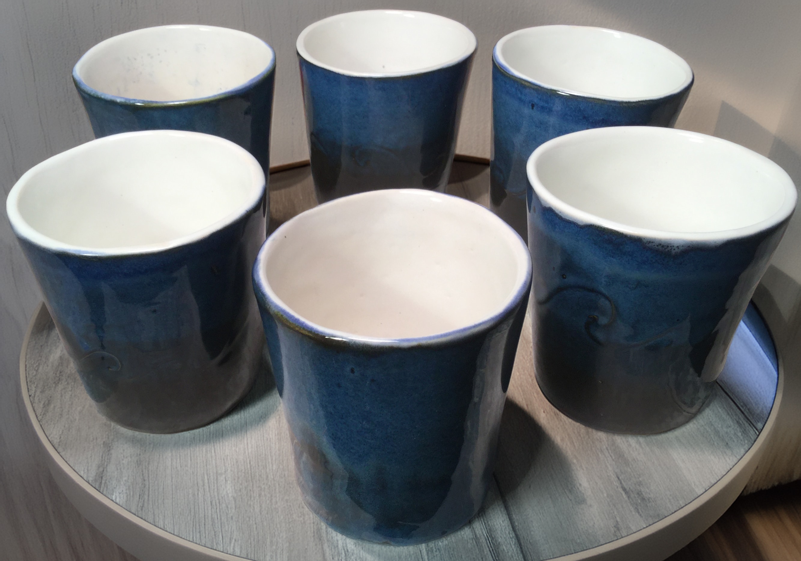 Finished ceramic pieces on display after kiln firing